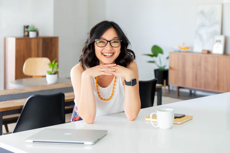 Woman smiling at the kitchen bench
